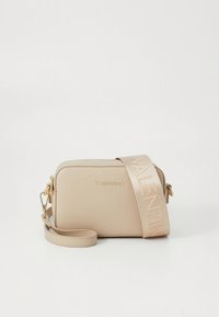 Beige Valentino crossbody bag with textured leather, gold hardware, and wide strap printed with "VALENTINO" in large letters.