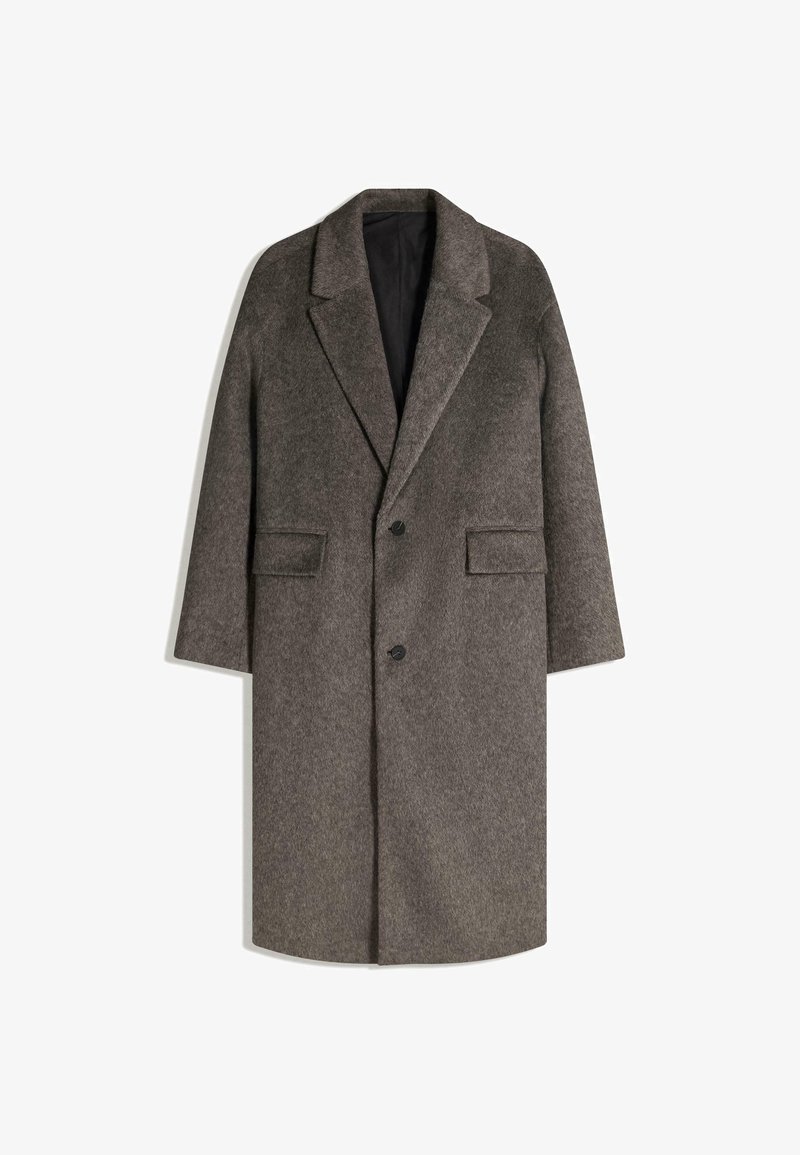Cappotto di lana grigio con rever a punta, design monopetto, due tasche frontali e foderato internamente in modo liscio. Presenta bottoni neri.