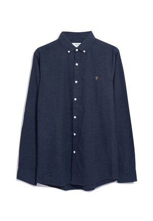 Camicia blu navy con bottoni, colletto, maniche lunghe, bottoni bianchi e un piccolo logo dorato sul petto. Realizzata in tessuto morbido.