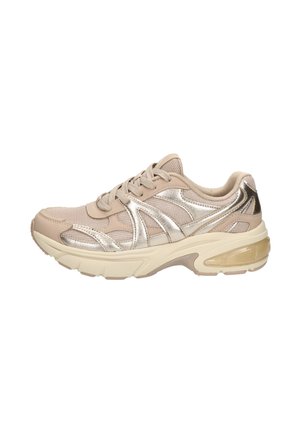 Athletic shoe in beige with metallic silver accents. Features mesh and synthetic upper, lace closure, and a cushioned sole for comfort.