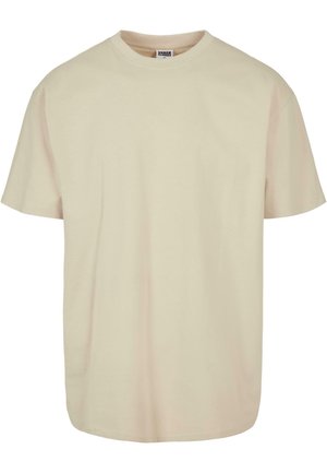 Short sleeve t-shirt in light beige cotton with a crew neckline, featuring a relaxed fit and smooth texture, no visible patterns or accents.