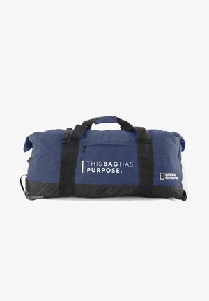 Navy and black duffel bag made of durable fabric, featuring sturdy handles, a zippered pocket, and printed text: "THIS BAG HAS PURPOSE."