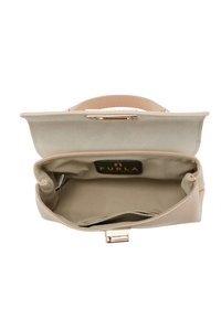 Light beige leather handbag with a structured shape. Interior features a fabric lining and a gold-tone clasp for closure. Furla logo visible inside.