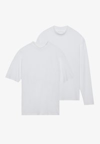 Two white t-shirts: one short-sleeved with a crew neck, the other long-sleeved with a ribbed collar. Both have a smooth cotton texture.