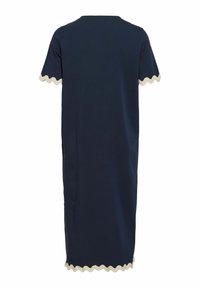 Robe midi bleu marine à manches courtes, bordure beige ondulée sur les bords des manches et de l'ourlet, coupe droite, vue de dos.