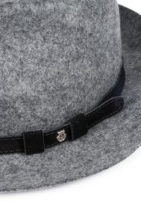 Gray felt hat with a wide brim, featuring a black suede band and metallic accent on the side. Soft texture, round shape.