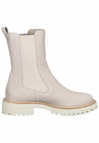 Botte Chelsea beige en cuir mi-mollet avec panneaux latéraux élastiques, languette de tirage, surpiqûres couleur caramel et semelle épaisse blanche à crampons.
