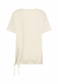 Cremefarvet løstsiddende t-shirt med korte ærmer, rund halsudskæring og snoretræk i bunden for justerbarhed.