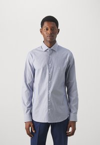 Camicia a righe azzurro chiaro e bianca, con colletto, maniche lunghe e vestibilità slim. Tessuto morbido con una superficie liscia.