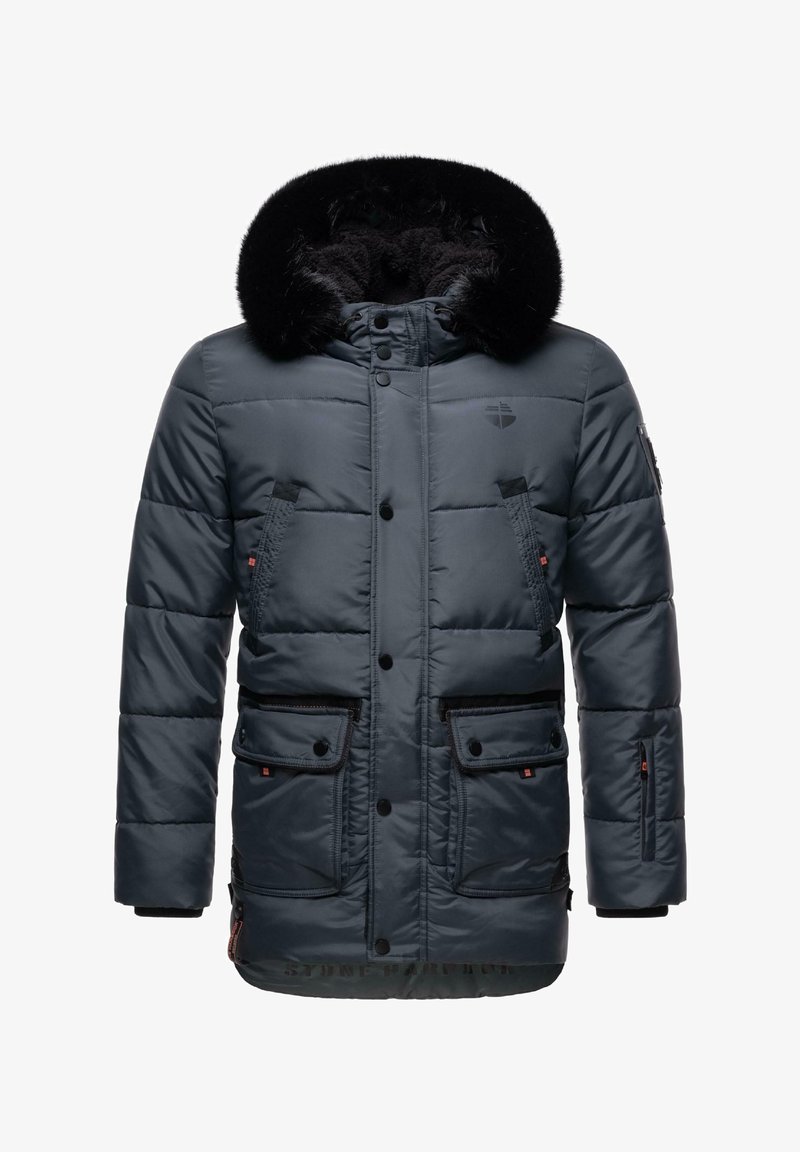 Polsterdatud tumesinine jakk läikiva viimistlusega, mustast kunstkarvast kapuuts, kaks esimest lipsukotiga taskut ja tõmblukuga käistasku. Omab nööbiga kinni pandavat sulgemist.