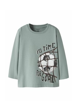 Long-sleeve sage green shirt with a soccer ball caught in a net and the text "It's time for goal" printed on the front.