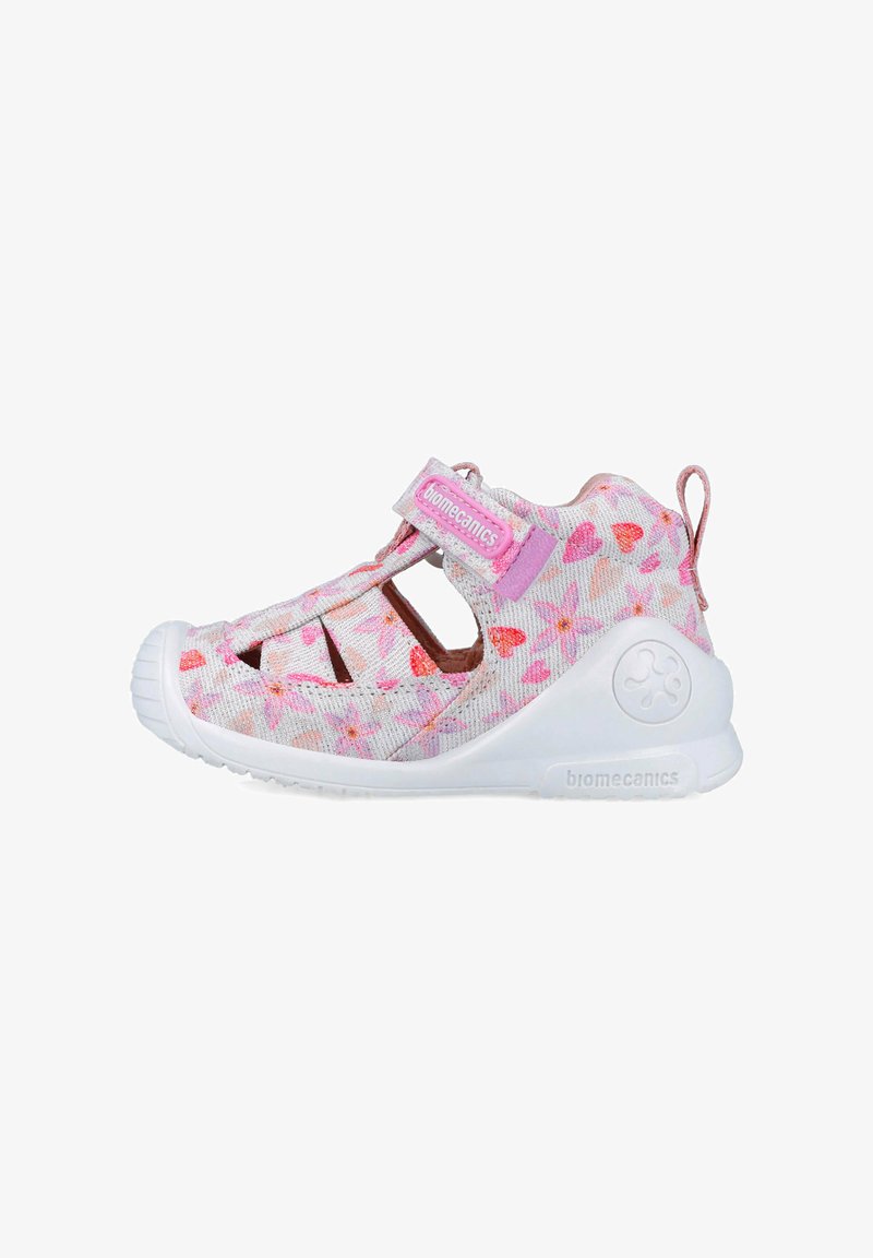 Sandalias ligeras para niños en blanco y rosa, con un patrón floral, correa ajustable y aberturas de ventilación en los laterales.