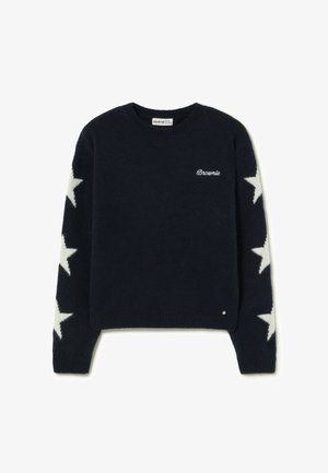 Suéter de punto azul marino con patrones de estrellas blancas en las mangas, puños y dobladillo acanalados, y logo bordado de "Brownie" en el frente.