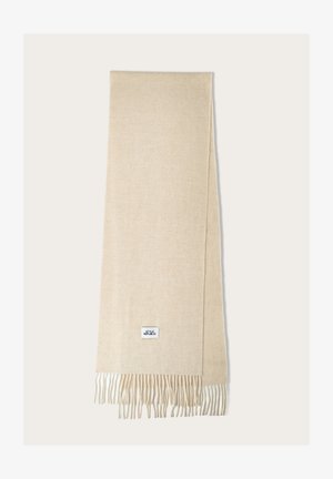 Beige scarf made of soft fabric, featuring fringe edges and a small, square brand label in blue and white.