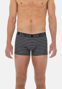 Boxers-briefs ray és noirs et gris avec une ceinture décorée du logo. Le tissu semble lisse et élastique, conçu pour un ajustement près du corps.