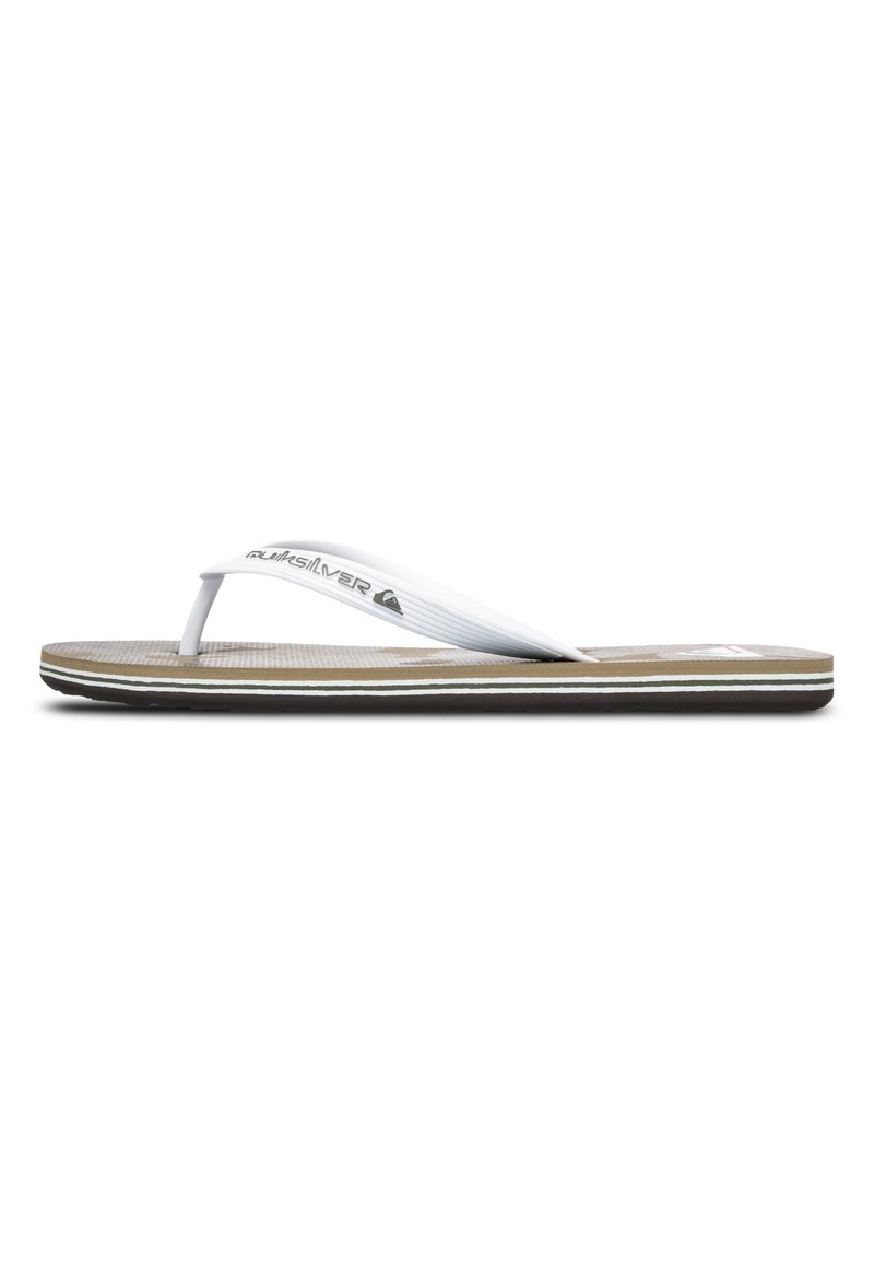 Brune flip-flop med en tekstureret fodseng og hvide gummistropper. Har hvide accentstriber langs sålen. Quiksilver-logo på stropperne.