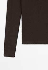 Dark brown long-sleeve knit sweater with a straight hem and visible lighter inner lining at the cuffs and bottom edge.