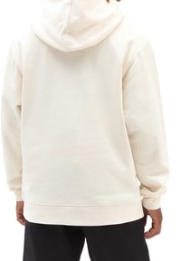 Cream-colored hoodie made of soft fabric with a drawstring hood, ribbed cuffs, and a straight hem, featuring a minimalist design.