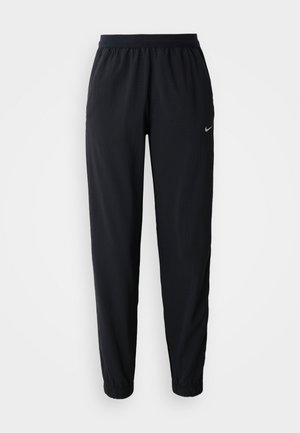 Pantalones de chándal negros de Nike con waistband elástico, pierna ajustada y tobillos acampanados, que presentan un sutil patrón texturizado y detalle del logo.