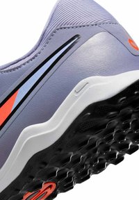 Light purple athletic shoe with textured material, white and black sole, red and blue accents, and sleek design features.