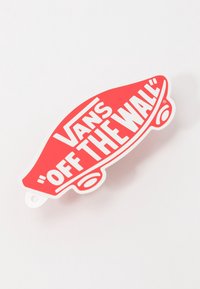 Red Vans "Off the Wall" logo keychain, featuring a skateboard shape, white accents, and bold typography. Smooth plastic texture.
