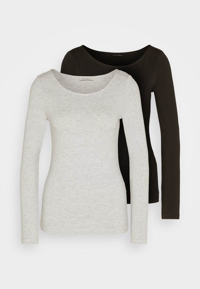 Dos blusas de manga larga, una gris y una negra, con escote redondeado. La tela parece suave con una textura lisa y un detalle mínimo.