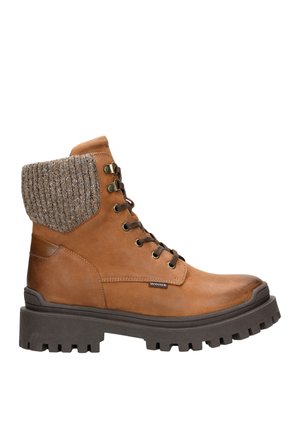 Bruine leren veterschoenen met een geribbelde kraag van wolaccenten en een robuuste rubberen zool, voorzien van metalen oogjes en een logo-tag.