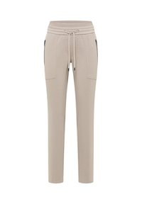 Béžové tepláky s elastickým pasem a stahovací šňůrkou. Mají dvě boční kapsy na zip a zužující se střih nohavic. Měkká textura.