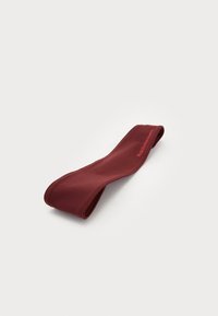 Burgundy elastic headband with a smooth texture, featuring a subtle logo in red. Designed for fitness or casual wear.