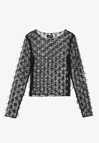 Top lungo nero trasparente realizzato in materiale testurizzato, con un motivo a griglia e fiocchi decorativi 3D lungo le maniche e il corpo.