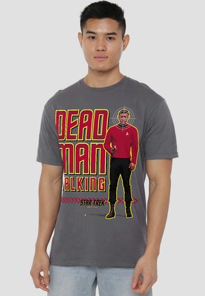 Graues Baumwoll-T-Shirt mit einem grafischen Druck und fettem gelbem Text "DEAD MAN WALKING" sowie einem Charakter in roter Uniform aus Star Trek.