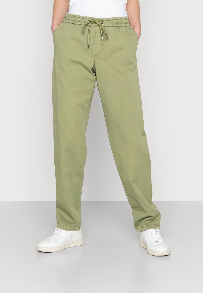 Light olive green casual pants with an elastic waistband and drawstring closure; features two side pockets and a relaxed fit.