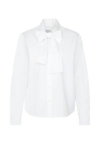 Chemise blanche à manches longues avec boutons sur le devant, ornée d'un grand nœud noué au col, présentant une coupe classique et un design épuré et ajusté.