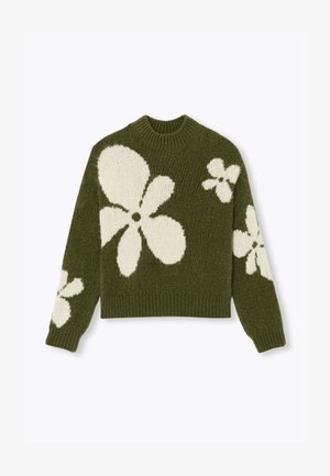 Pull en tricot vert avec de grands motifs floraux blancs, col rond et poignets côtelés. Texture douce, design cropped.