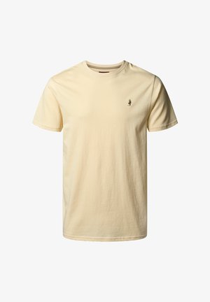 T-shirt in cotone giallo chiaro con collo a giro. Presenta un logo ricamato sottile in una tonalità più scura sul lato sinistro del petto. Maniche corte.