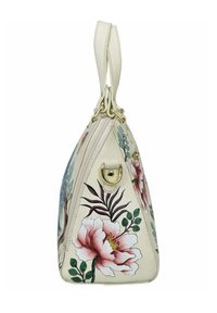 Blumenhandtasche mit einem cremefarbenen, strukturierten Lederaußenmaterial, das pinke und grüne Blumenmuster sowie goldfarbene Beschläge aufweist. Reißverschlussverschluss an der Oberseite.