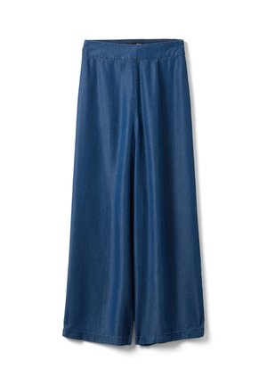 Pantalones vaqueros azules de pierna ancha y cintura alta, con un frente liso y sin bolsillos ni botones visibles, mostrados sobre un fondo blanco.