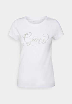 Hvid T-shirt med korte ærmer og rund hals, med sølvfarvet rhinsten "Guess"-logo på brystet.