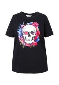 Sorte bomulds T-shirt med en grafik af et hvidt kranium omgivet af farverige blomsterdesigns i pink, blå og grønne nuancer.