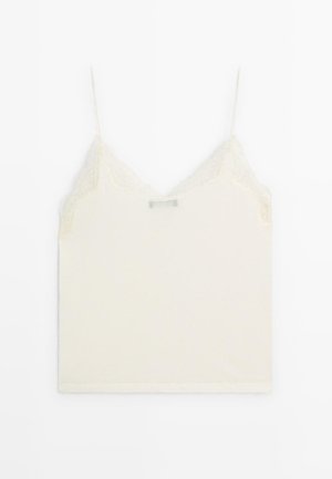 Camisola crema con spalline regolabili, caratterizzata da un bordo in pizzo lungo il collo e da una texture morbida e liscia.