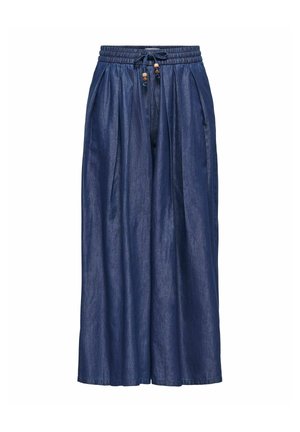 Pantalon large en jean bleu avec ceinture élastique et cordon orné de perles en bois, présenté sur fond blanc.