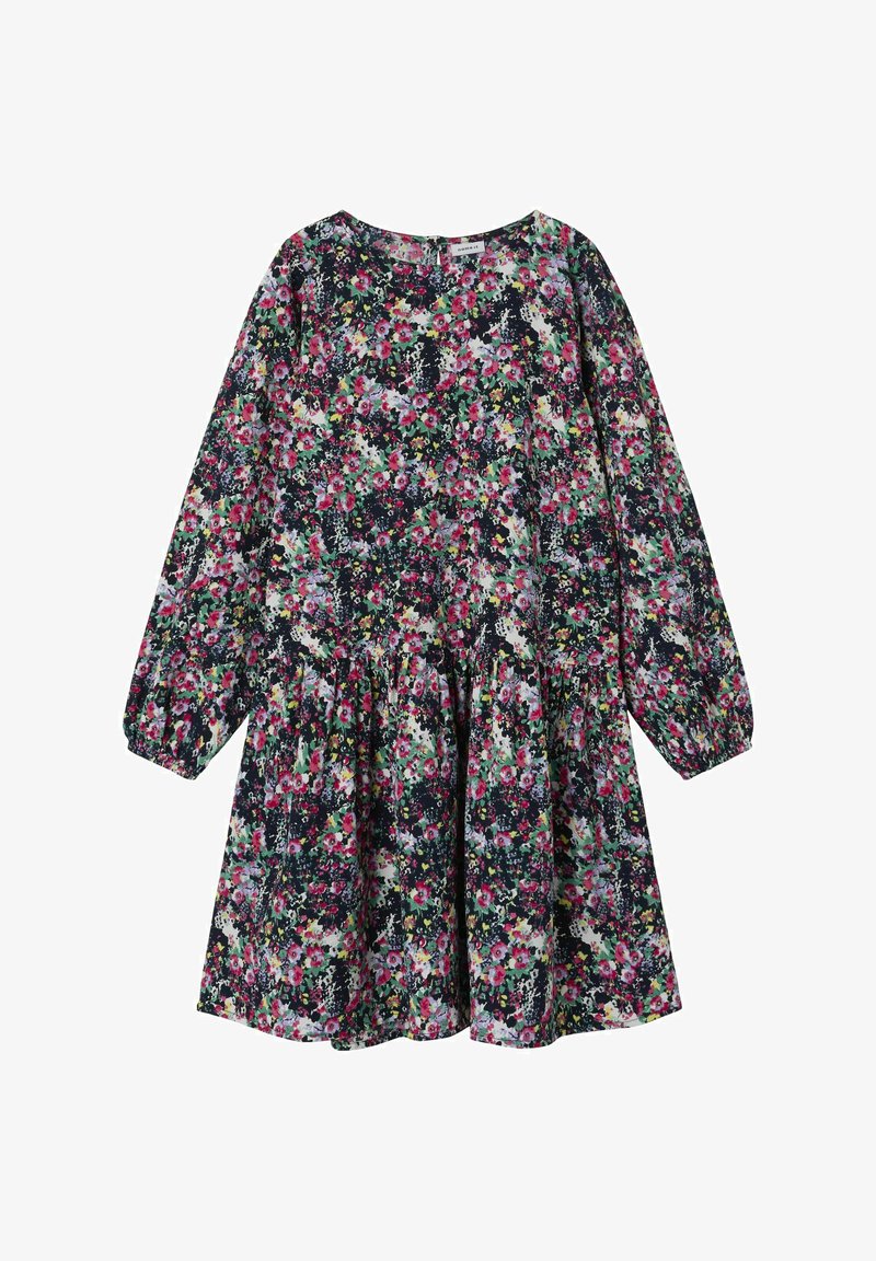 Lillelillede kleit pikkade varrukatega, ümmarguse kaelusega ja volangiga seelikuosa. Selles on erksad lilled tumedal taustal. Kerge kangas.