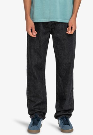 Black denim jeans with a loose fit, featuring a classic five-pocket design, subtle fading, and stitched detailing along the side seams.