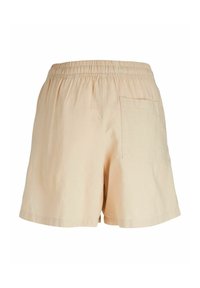 Beige shorts tillverkade av ett lätt material, med resårmidja och en enda bakficka. Mjuk textur med avslappnad passform.
