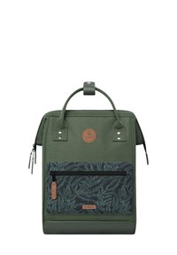 Green backpack with a textured finish, featuring a front zip pocket with a leaf-patterned fabric, leather accents, and dual top handles.