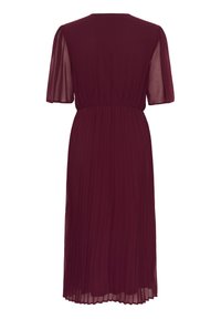 Burgundy pleated dress with short, sheer sleeves, cinched waist, and flowing skirt reaching mid-calf. Soft, lightweight fabric texture.