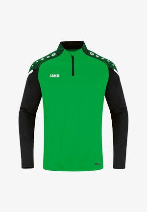 Haut de sport à manches longues vert et noir avec fermeture éclair au quart, logo blanc "JAKO" sur la poitrine, panneaux d'épaule verts à motifs avec des points blancs.