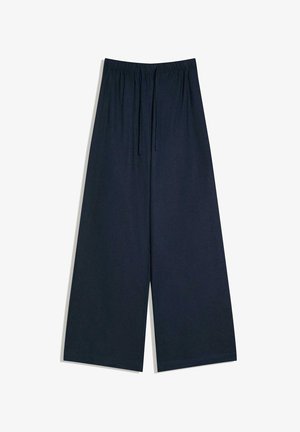 Laajan lahkeen tummansiniset housut, joissa on joustava vyötärö ja kiristysnyöri, valmistettu pehmeästä, laskeutuvasta kankaasta.