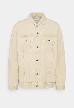 Veste en velours côtelé beige clair avec fermeture à boutons, deux poches poitrine à rabats boutonnés et un col classique.