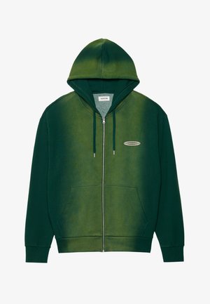Green zip-up hoodie with a gradient design, made of soft fabric. Features a hood, front pockets, and a small logo on the chest.